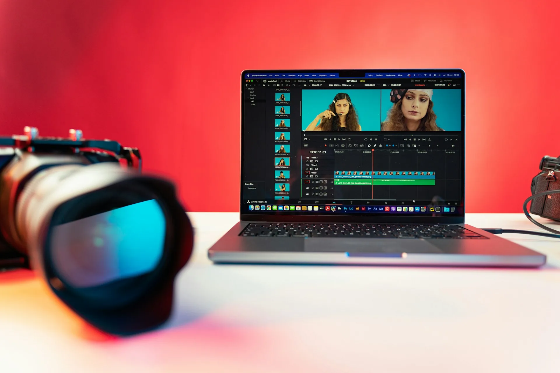 Video editor working on a laptop with post-production software