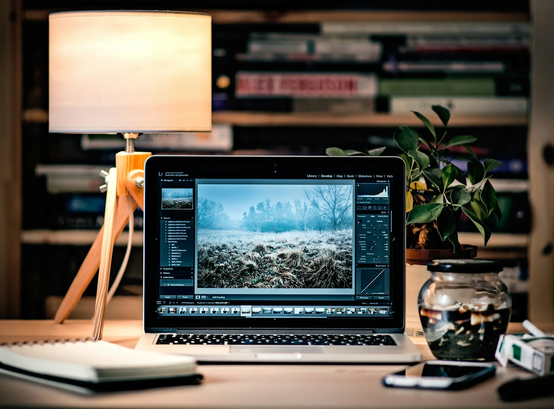 Laptop on a wooden table with content planning material