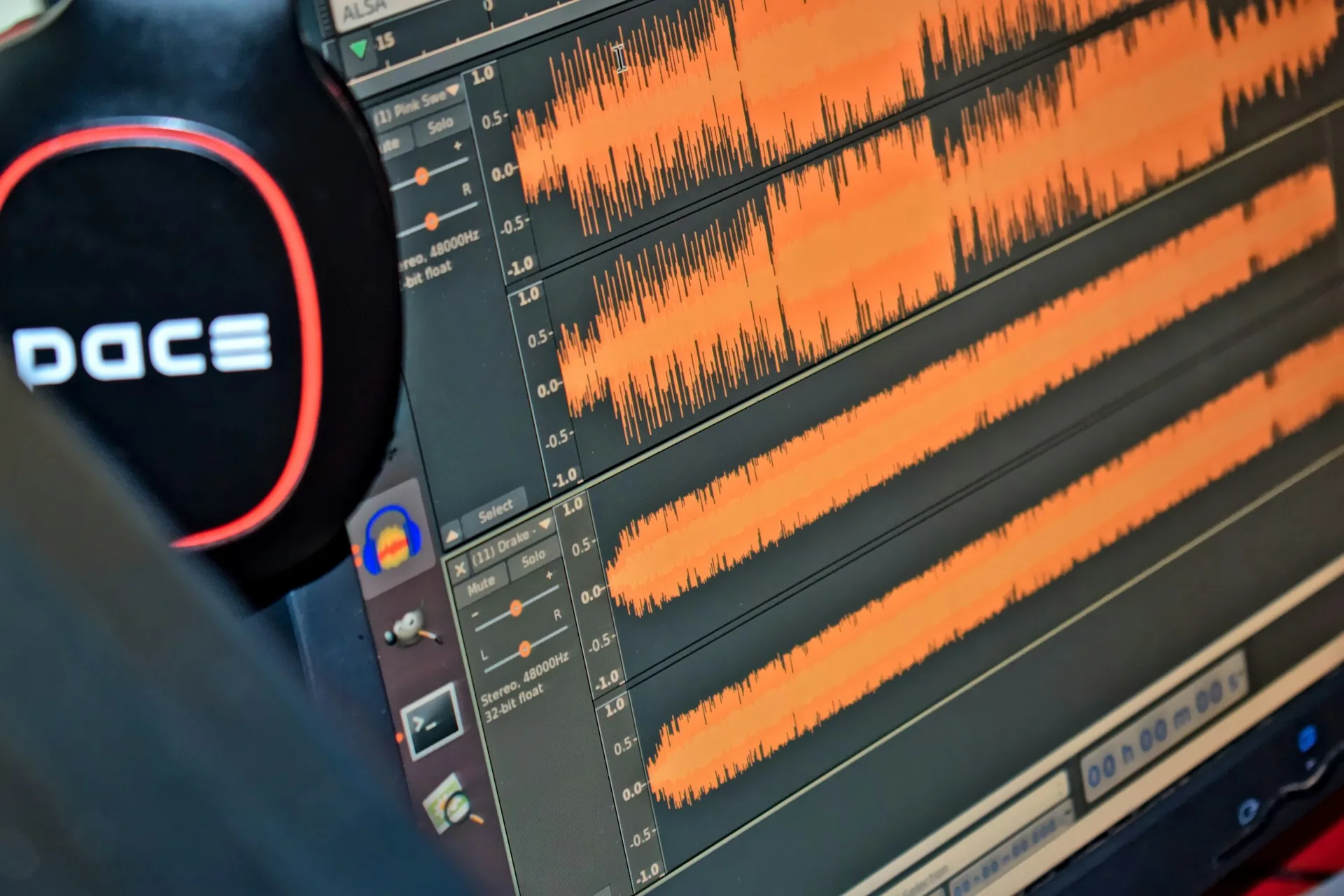 Headphones on a computer monitor during a video editing session