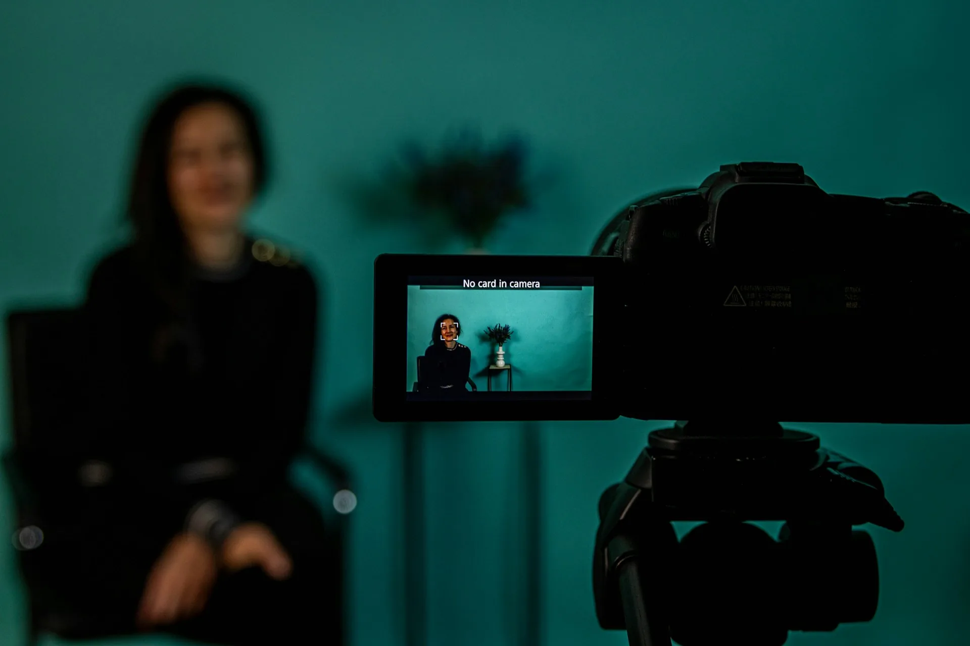 Person speaking directly to camera in a talking head format inside a recording studio