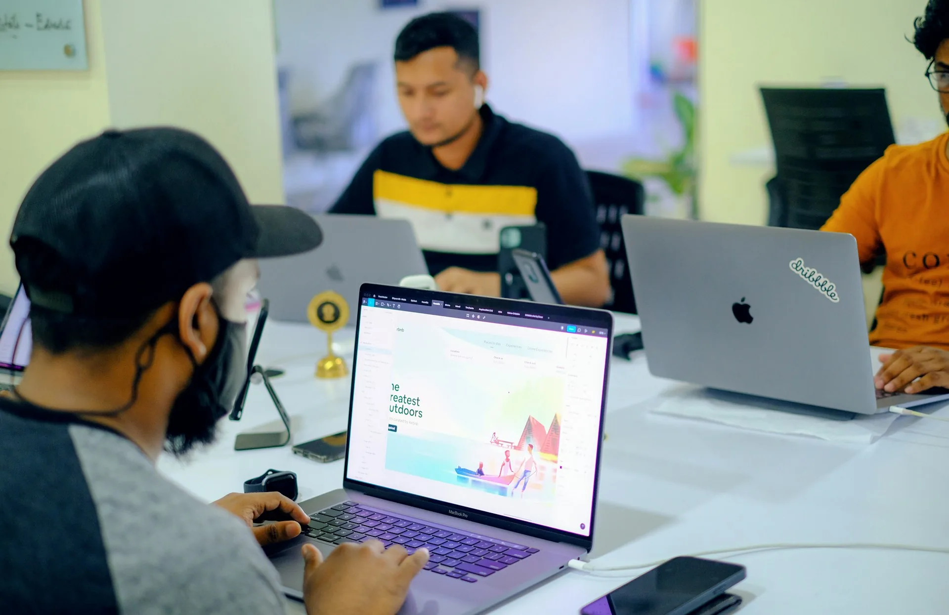 Person working on a laptop on a digital agency web page